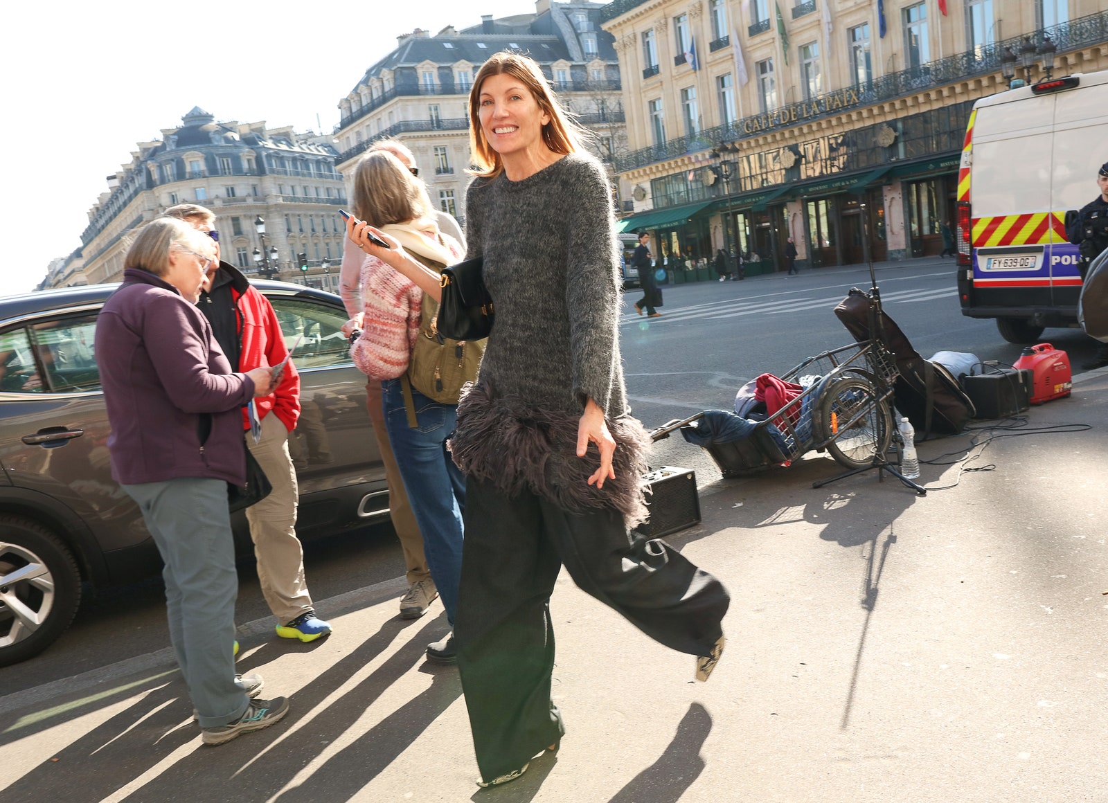 Images may contain city road street city people walking shoes shoes pants pockets and handbags